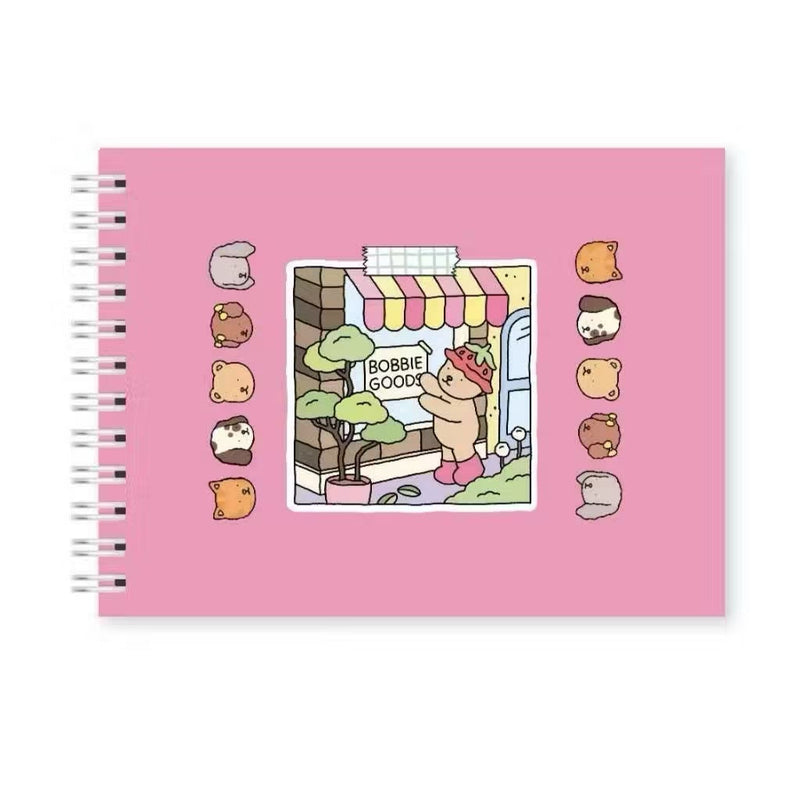 Livro de Colorir Bobbie Goods com ilustrações divertidas e capa em rosa