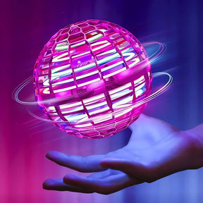 Bola Mágica em tons de rosa flutuando acima da mão com fundo iluminado azul e roxo