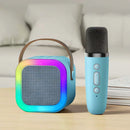 Caixa de som azul com microfone, ideal para karaokê infantil com iluminação colorida