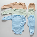 Kit body manga longa bebê composto por roupas em tons pastel, ideal para conforto e estilo infantil