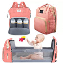 Mochila Bolsa Maternidade em rosa com compartimentos para mamadeiras e berço desmontável para bebês