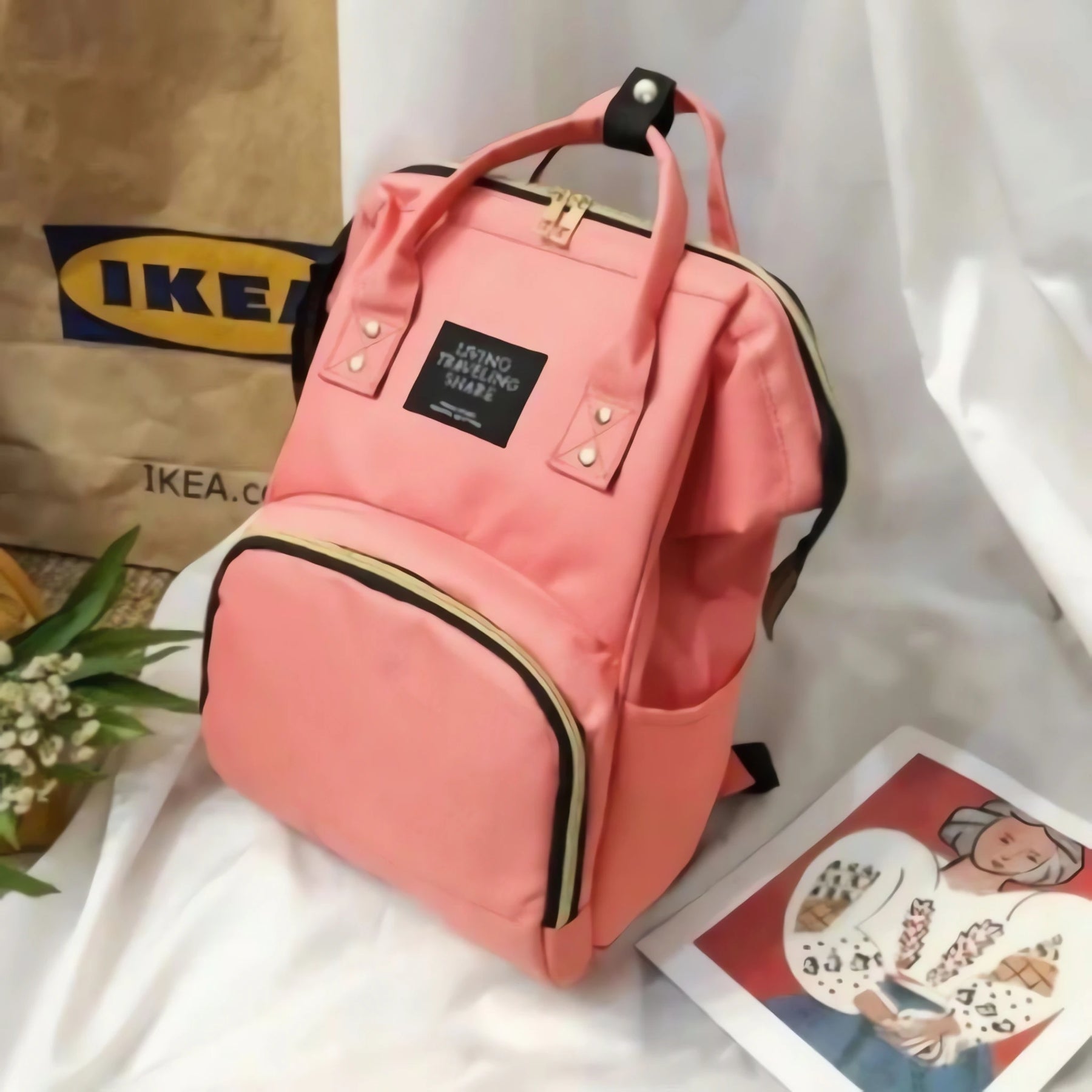 Mochila Maternidade Multifuncional em rosa com compartimentos práticos para mães modernas